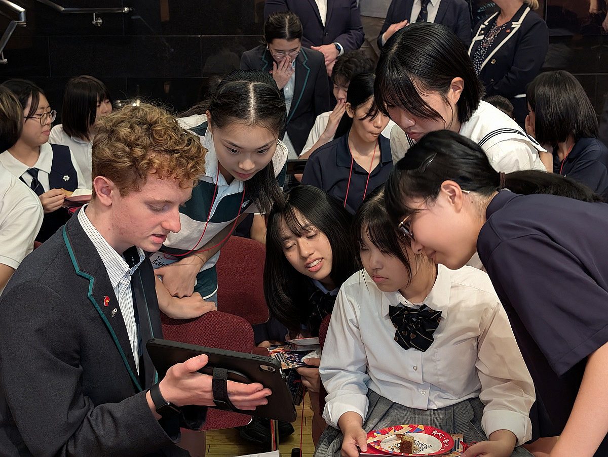 25042 TI Harry demonstrating Ed Chat to students at the Australian Embassy