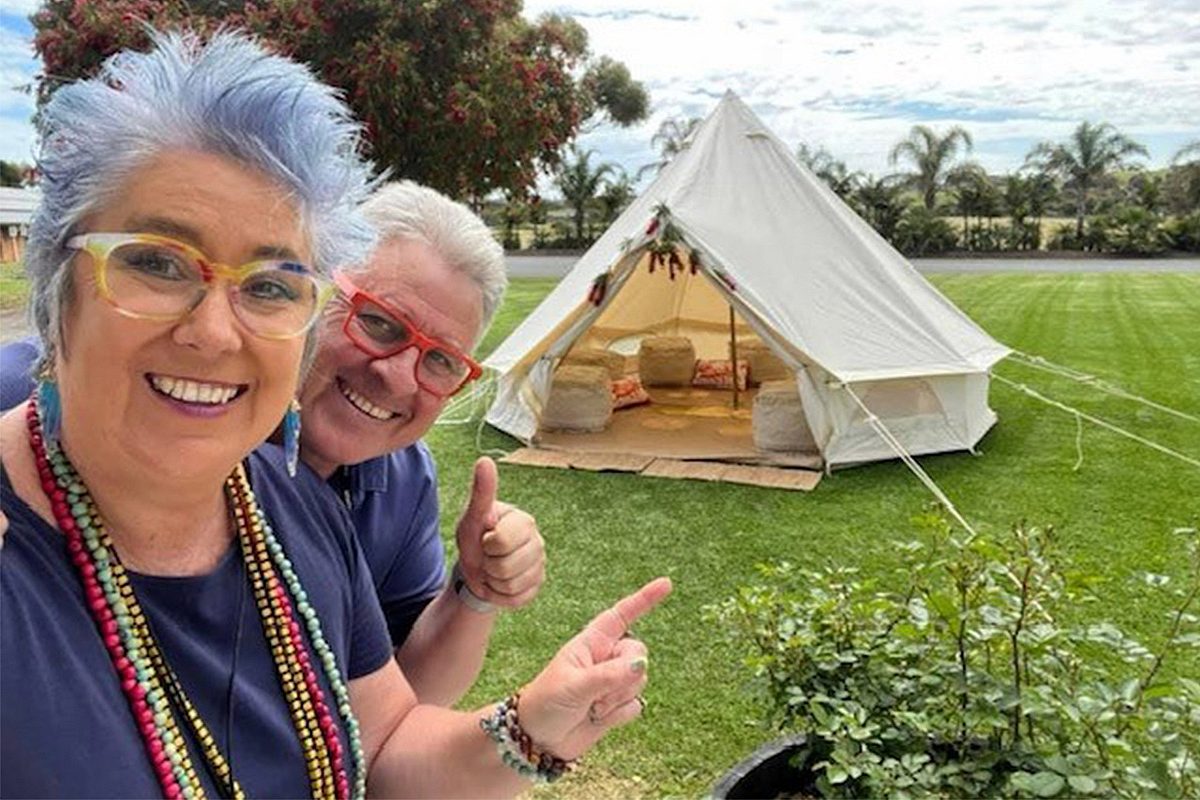 Woman and man pointing at glamping tent